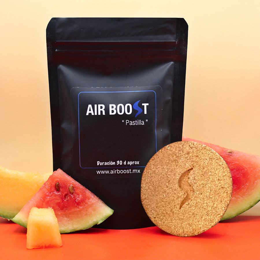 Empaque negro con pastilla naranja y rodajas de sandía